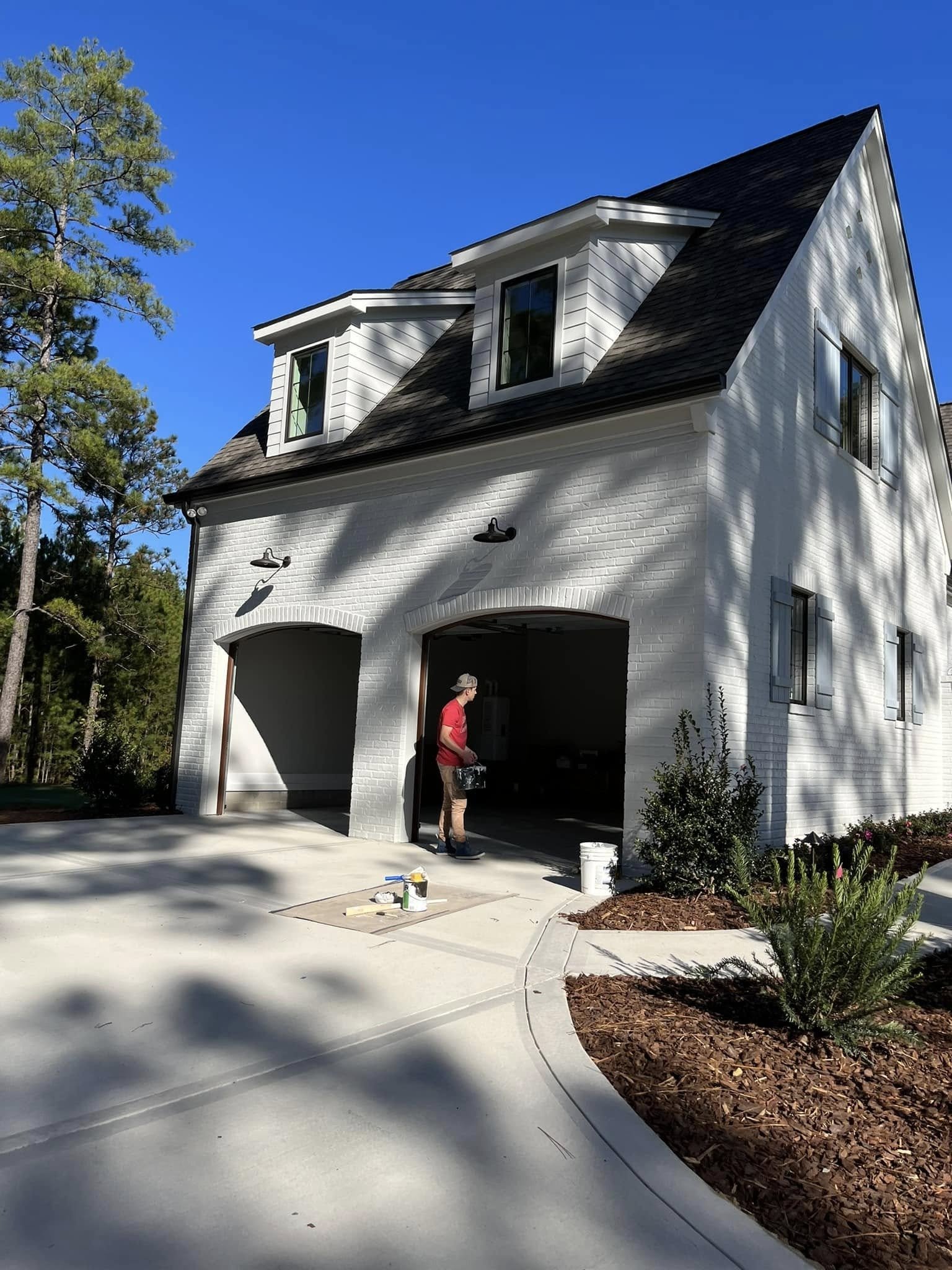 Uwharrie Pro Builders crew on site, exterior finish work